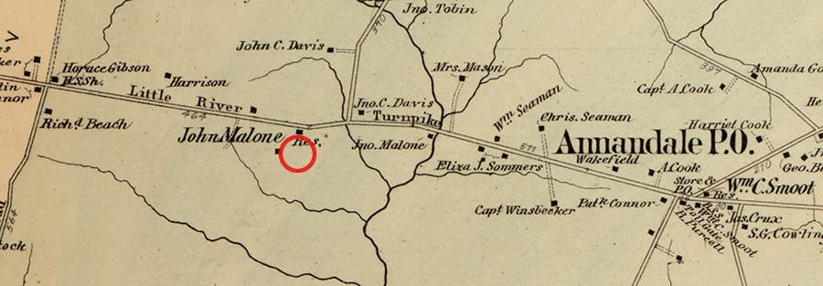 Color map of Fairfax County drawn in 1878 by Griffith Morgan Hopkins, provided courtesy of the Library of Congress. The approximate location of Wakefield Forest Elementary School is shown by a red circle. The map shows a portion of Little River Turnpike between modern day Guinea Road and the village of Annandale. The names of several landowners and the locations of their homes are pictured on the map.  